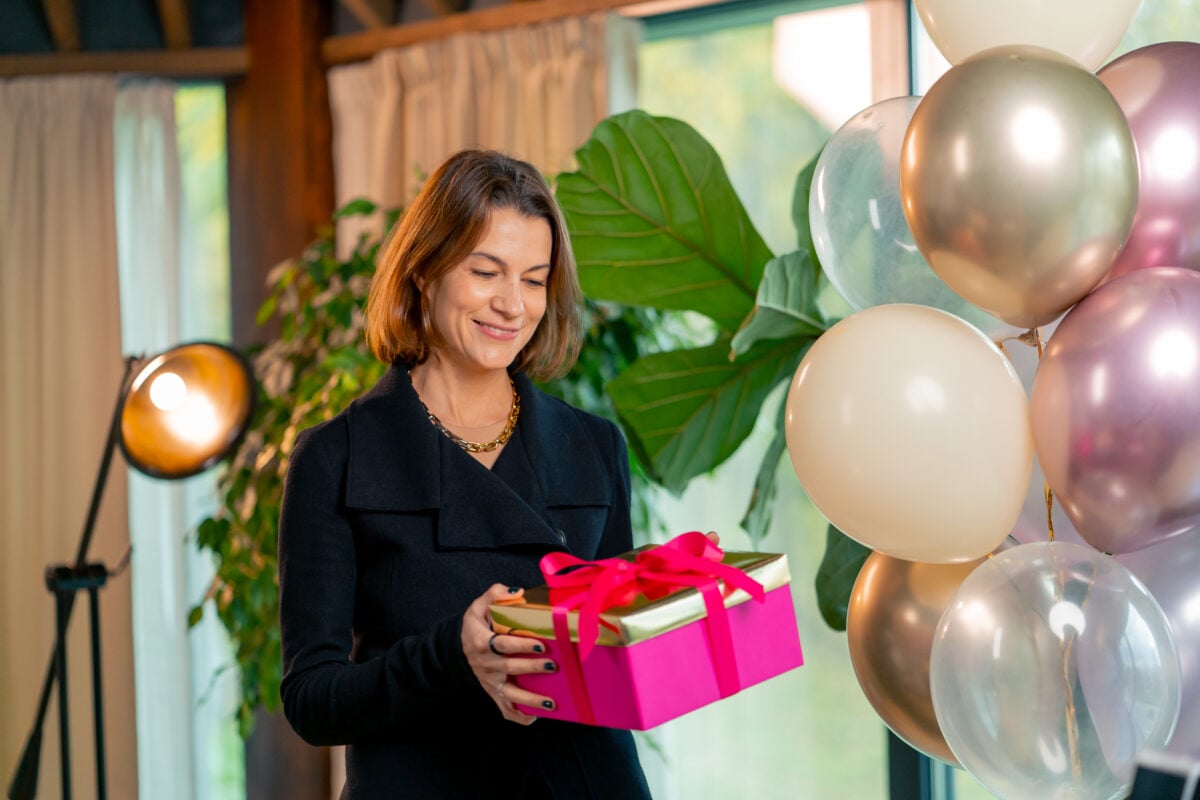 happy female birthday girl holding a bright gift b 2024 02 16 04 43 03 utc