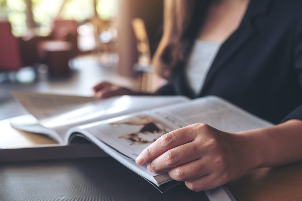 closeup image of a business woman reading a book i 2023 11 27 05 03 42 utc