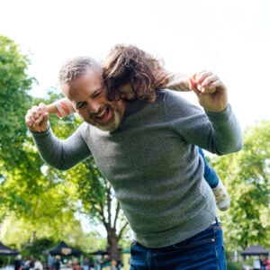 father giving a daughter piggyback ride when playi 2023 11 27 04 51 17 utc