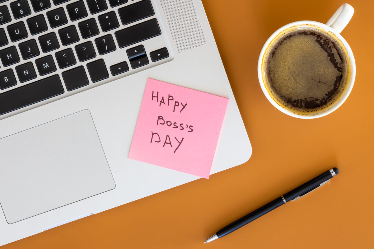 Boss’s Day 1 boss day concept laptop and cup of coffee on tabl 2024 02 21 00 45 45 utc