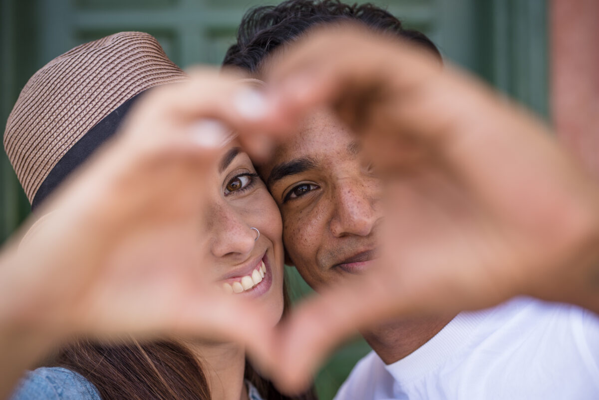 mixed race couple do hearth sign with hands looki 2023 11 27 04 58 15 utc