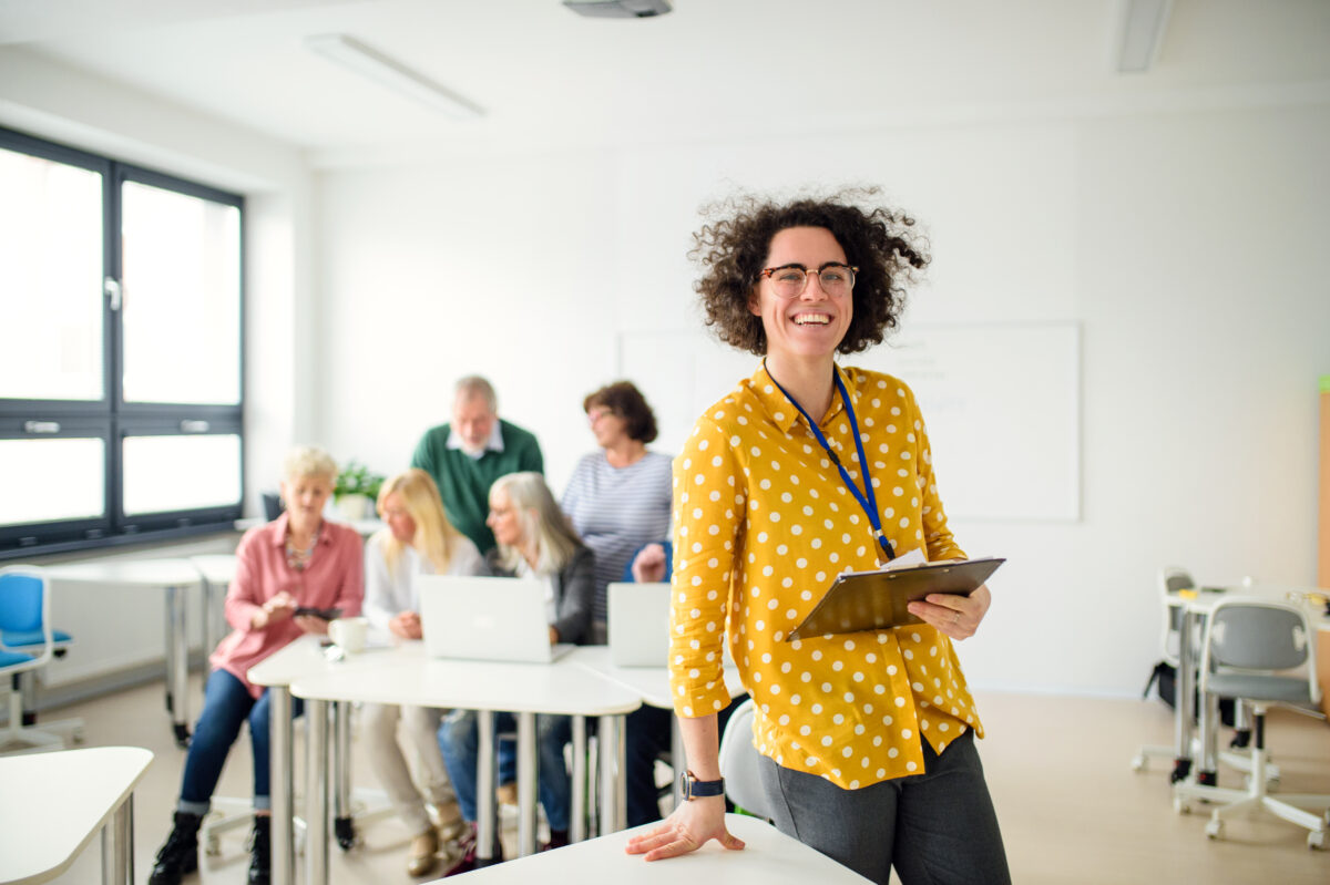 portrait of teacher with seniors attending compute 2023 11 27 04 56 33 utc
