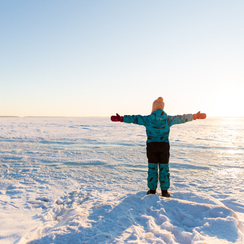 Journey to the North Pole: A Magical Experience Like No Other 5 a child stands with his arms outstretched against 2023 11 27 05 31 12 utc