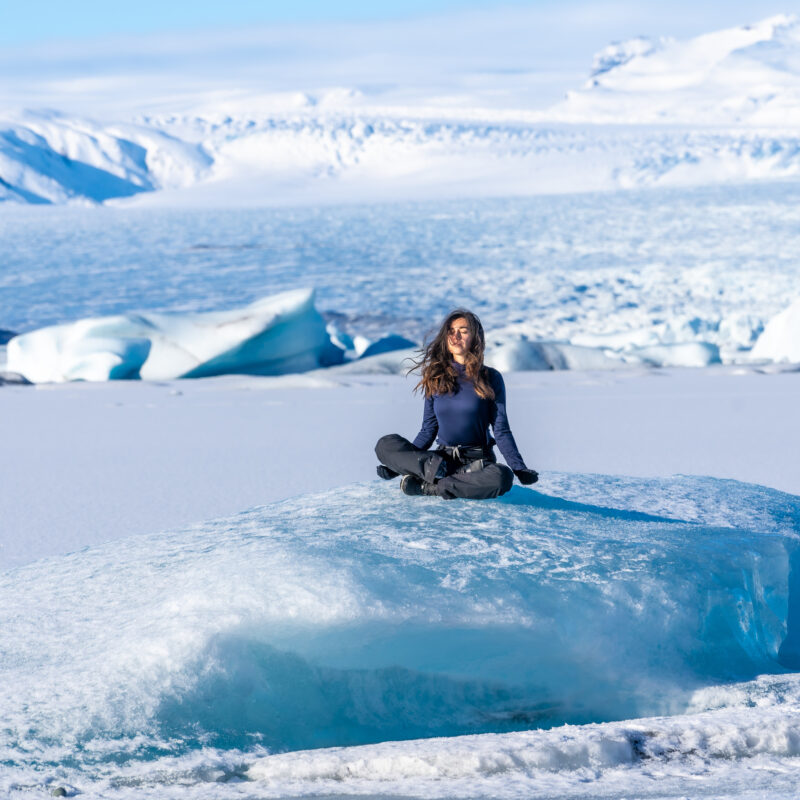Journey to the North Pole: A Magical Experience Like No Other 6 a woman is sitting on a large block of ice 2024 09 20 00 44 38 utc