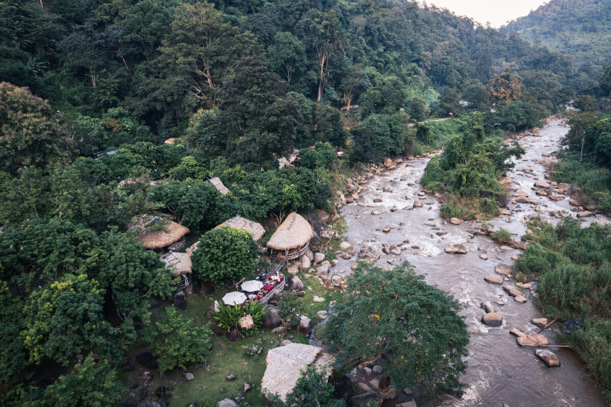 aerial view of wooden bungalow in tropical rainfor 2024 08 20 22 20 47 utc