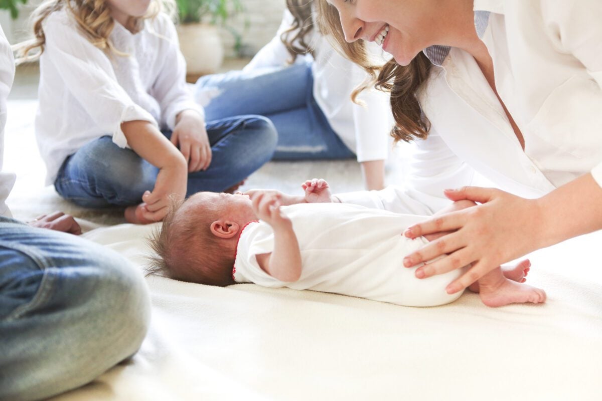 big family with three kids in white living room p 2024 08 07 21 59 18 utc