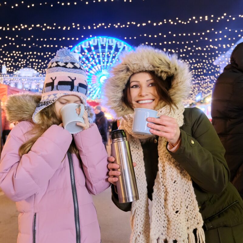 happy mom and daughter kid walking together drinki 2023 11 27 05 02 13 utc